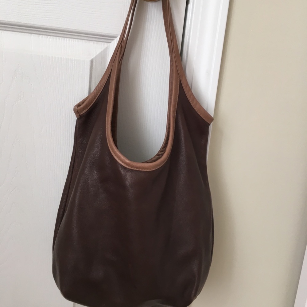 Rough and tumble leather sling purse
